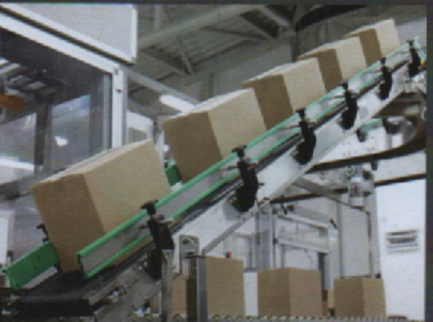 Cartons moving up an inclined conveyor line