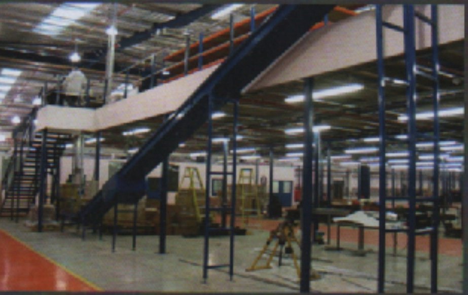 Conveyor running between warehouse floors