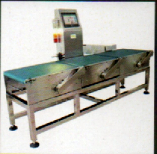 Inline check weigher on a stainless steel conveyor